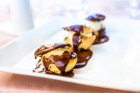 Profiteroles with chocolate sauceの写真素材