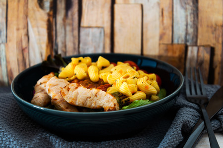 Caesar salad and Roasted Chicken of Italian Cheese tomatoesの写真素材