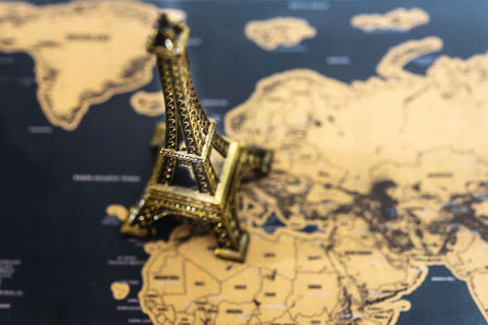 Eiffel tower above vintage retro map