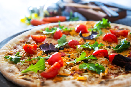 tasty chicken pizza on a the tableの写真素材