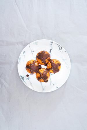 Profiterole with vanilla and chocolate sauce