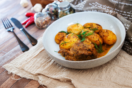 Piece of roasted pork and potatoesのeditorial素材