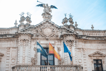 SEVILLA, SPAIN - January 13, 2018: Spanish flag in Old Town Sevilla, Spainのeditorial素材