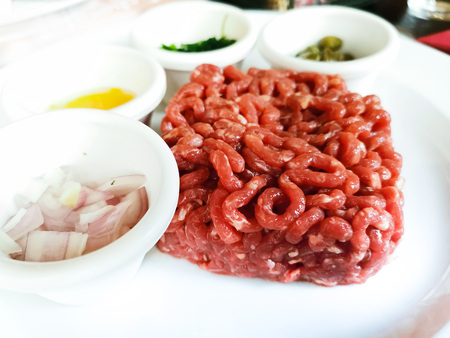tasty Steak tartare (Raw beef) - classic steak tartare on white plateの写真素材