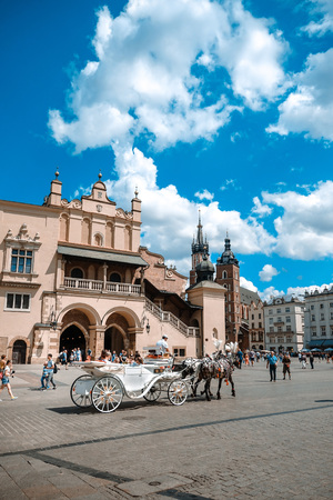 KRAKOW, POLAND - August 27, 2017: a horse and carriage carries tourists in Krakow, Polandのeditorial素材