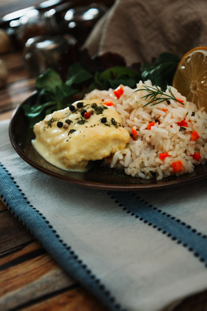 Andalusian fish, saffron rice with vegetablesの写真素材