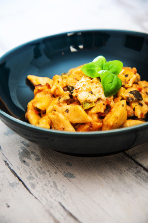 tasty pasta Italian tomato sauce pasta on the tableの写真素材