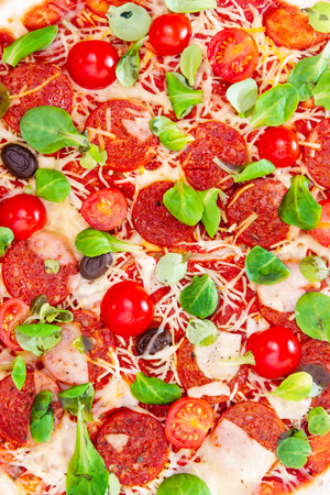 Sausage Pizza with Ham and tomatoesの写真素材