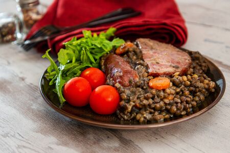 Green lentils with smoked pork sausage smoked choice, carrots and onionsの写真素材