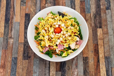 Delicious bacon chicken salad with cheese sauceの写真素材