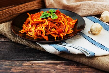 tasty pasta Italian tomato sauce pasta on the tableの写真素材