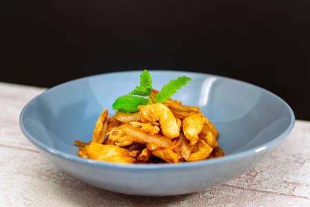 wok fried chicken stir fry with sweet peppers and chinese vegetablesの写真素材