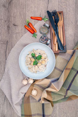 risotto with fresh cream, salted chicken, rehydrated ceps and mushroomsの写真素材