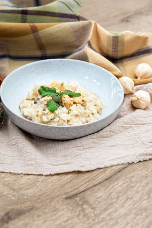 risotto with fresh cream, salted chicken, rehydrated ceps and mushroomsの写真素材