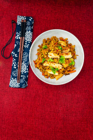 Chinese rice with vegetables and chickenの写真素材