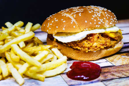 Cheese burger - American cheese chicken burger with fresh saladの写真素材