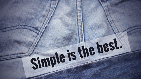 Inspirational quote "simple is the best" on blurred Jeans background with vintage filterの写真素材