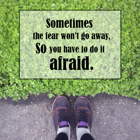 Inspirational quote "sometimes the fear won't go away,so you have to do it afraid" on blurred background with vintage filterの写真素材