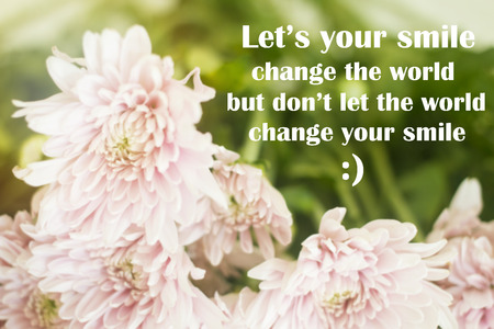Inspirational quote "let's your smile change the world, but don't let the world change your smile" on blurred background with vintage filterの写真素材