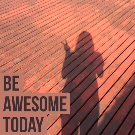 Inspirational quote be awesome today on woman's shadow background with vintage filter