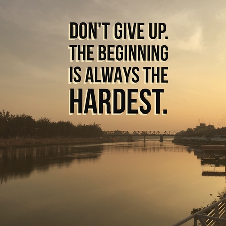 Inspirational motivational quote do not give up. The beginning is always the hardest." On river background.の写真素材