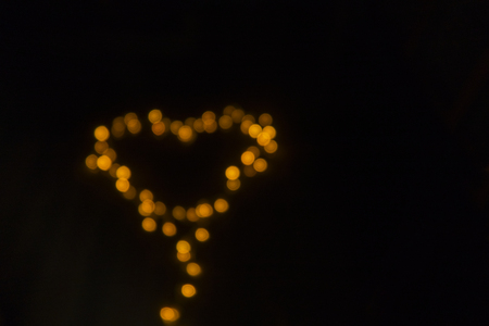 Blurred background of lights in heart shape. valentine theme.の写真素材