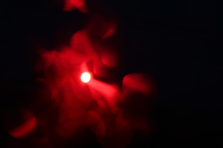 Abstract red light on black background.の写真素材