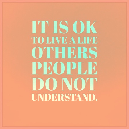 Inspirational Motivational quote it is OK to live alive others people do not 
Understand on orange background.の写真素材
