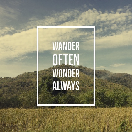 Inspirational motivational quote wander often, wonder always on mountain background.