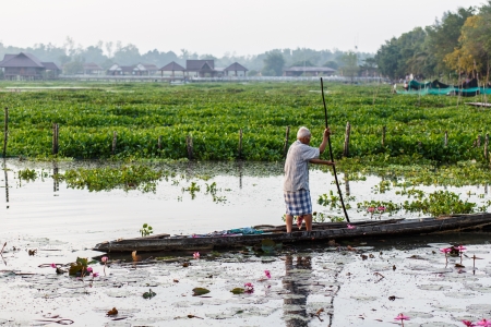 Old man on boat at Thalaynoi, Phathalung Province, South of Thailandのeditorial素材