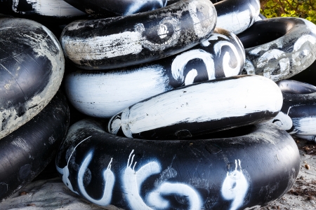 Stack of rubber tires from a beachのeditorial素材