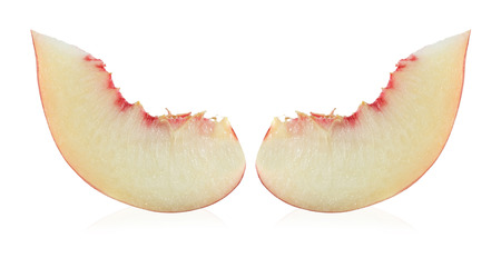 Ripe peach fruit slice isolated on white backgroundの写真素材