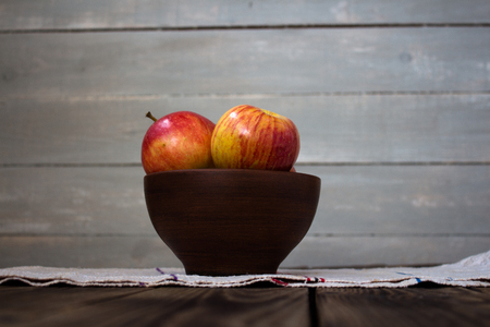 the apples on the wooden boardの写真素材