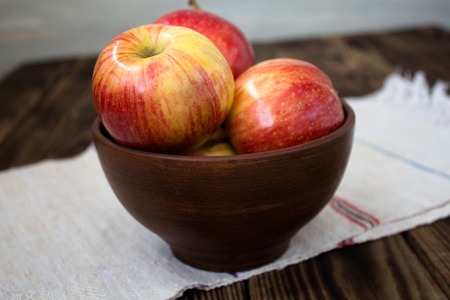 the apples on the wooden boardの写真素材