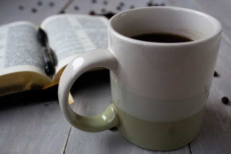 the Bible and coffee beans on boardの写真素材