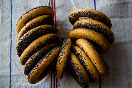 a bunch of bagels with poppy seedsの写真素材