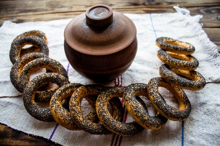 a bunch of bagels with poppy seedsの写真素材