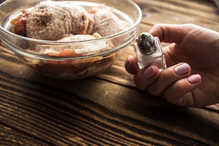 woman hand salt chickenの写真素材