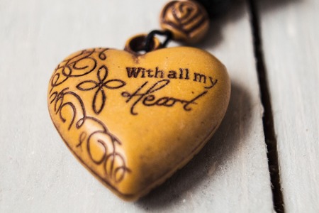 a christian charm with message on wooden backgroundの写真素材