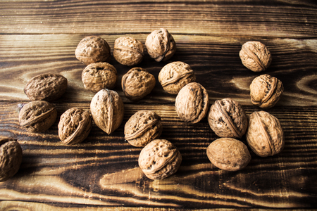 a walnuts on wooden background and texture