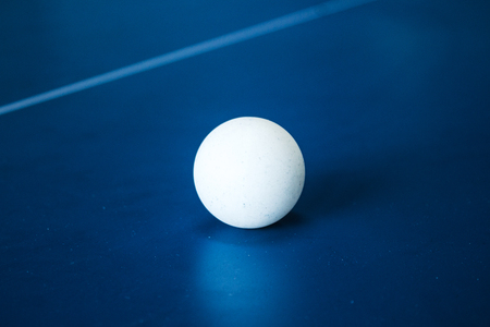 a tennis ball on a tennis tableの写真素材
