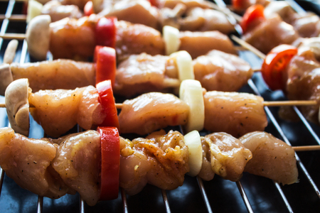 chicken shish kebab with tomato and mushroom barbecue on woodの写真素材