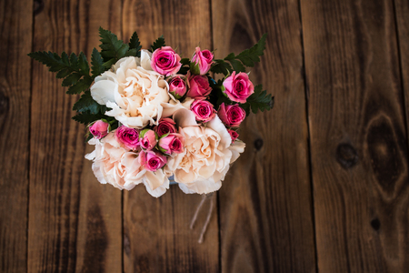 bouquet of roses on a wooden backgroundの写真素材