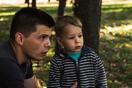 father and son a facial expression autumnの写真素材