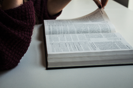 woman hands reading bible