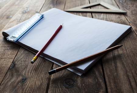 pencils and ruler near white sheet of paperの写真素材