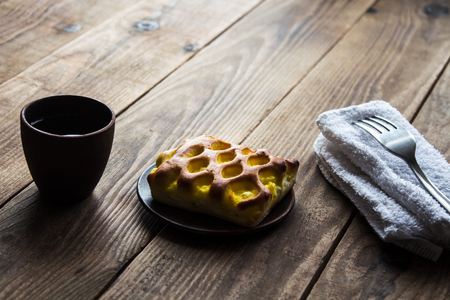 piece of cake with coffe on wooden backgroundの写真素材
