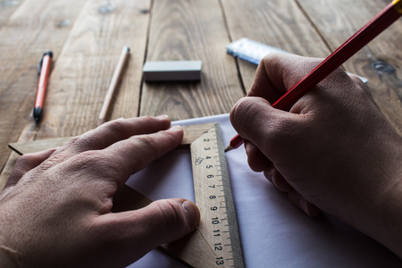 pencils and ruler near white sheet of paperの写真素材