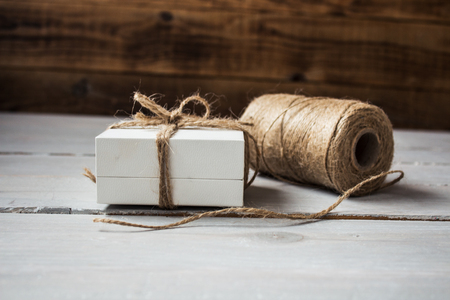 tangle of rope and box on wooden backgroundの写真素材