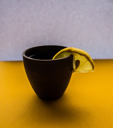 a alcoholic drink with lemon on white backgroundの写真素材